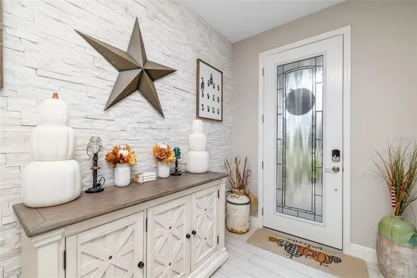 a kitchen with a refrigerator and a wooden cabinets