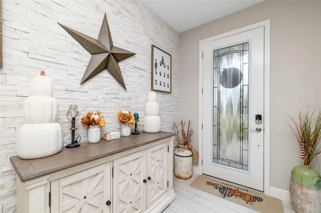 a kitchen with a refrigerator and a wooden cabinets