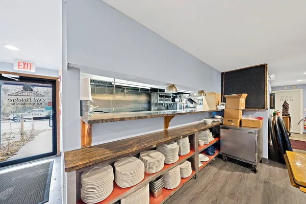 a kitchen with stainless steel appliances granite countertop a sink and wooden cabinets