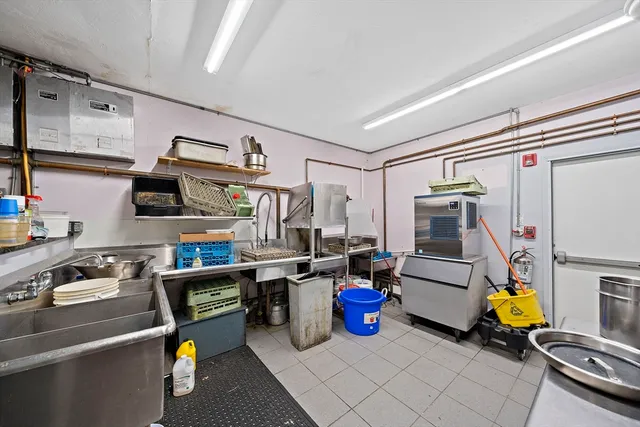 a bed room with furniture and a flat screen tv