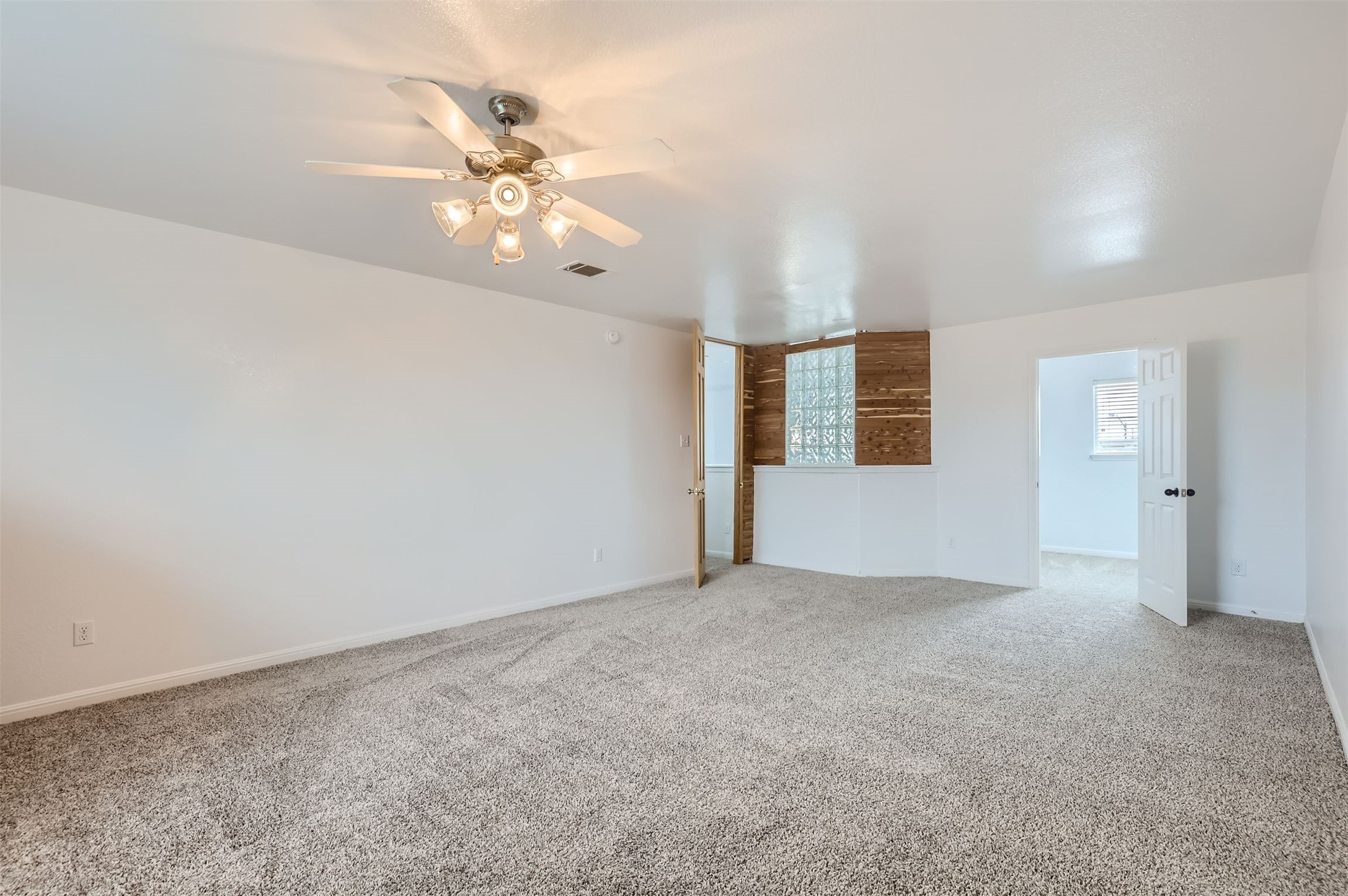 131 Lavaca Loop Hutto, TX 78634 - Photo 15 of 29 A spacious room with soft carpeting and a ceiling fan awaits your personal touch.