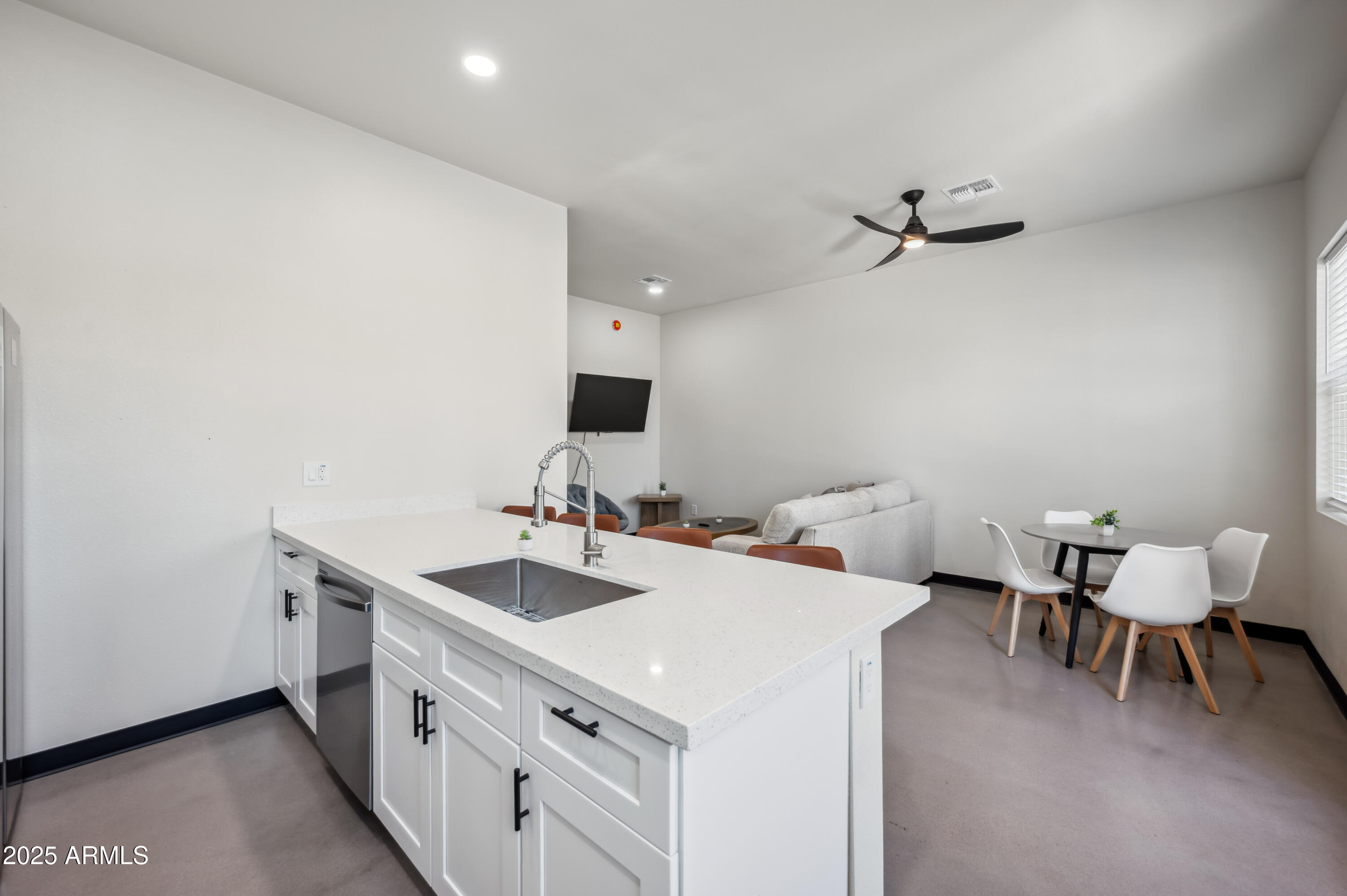 4136 North 11th Street Phoenix, AZ 85014 - Photo 11 of 33 a view of a kitchen area with furniture and wooden floor
