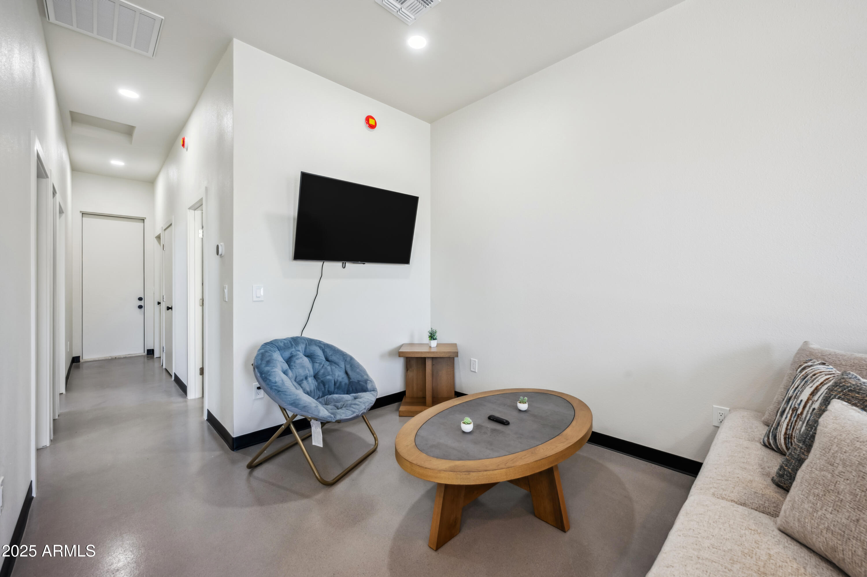 4136 North 11th Street Phoenix, AZ 85014 - Photo 15 of 33 a living room with furniture and a flat screen tv