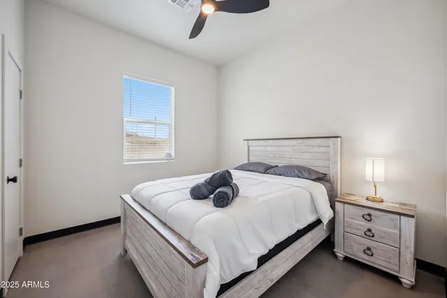 a bedroom with a bed and window