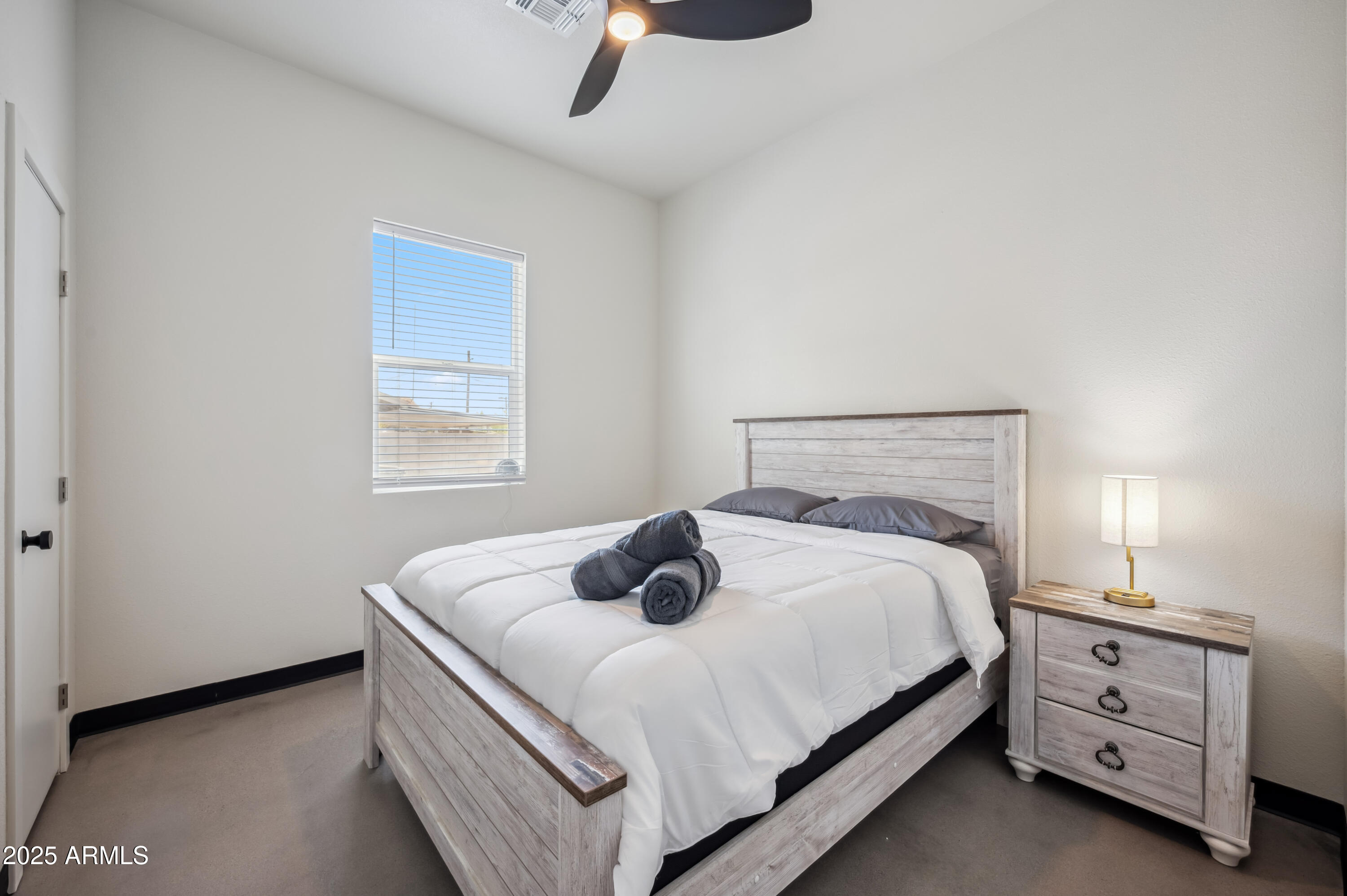 4136 North 11th Street Phoenix, AZ 85014 - Photo 16 of 33 a bedroom with a bed and window