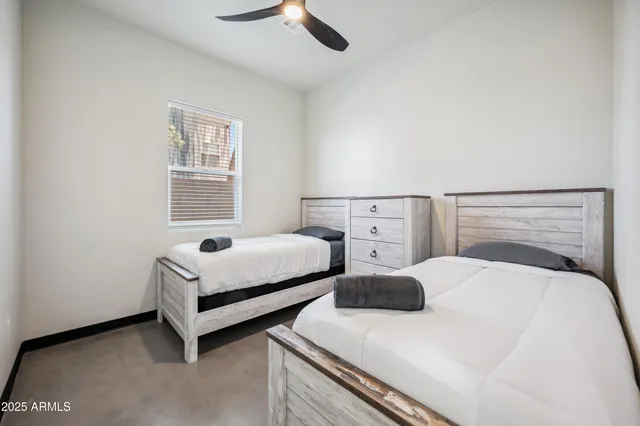 a bedroom with a bed and a window