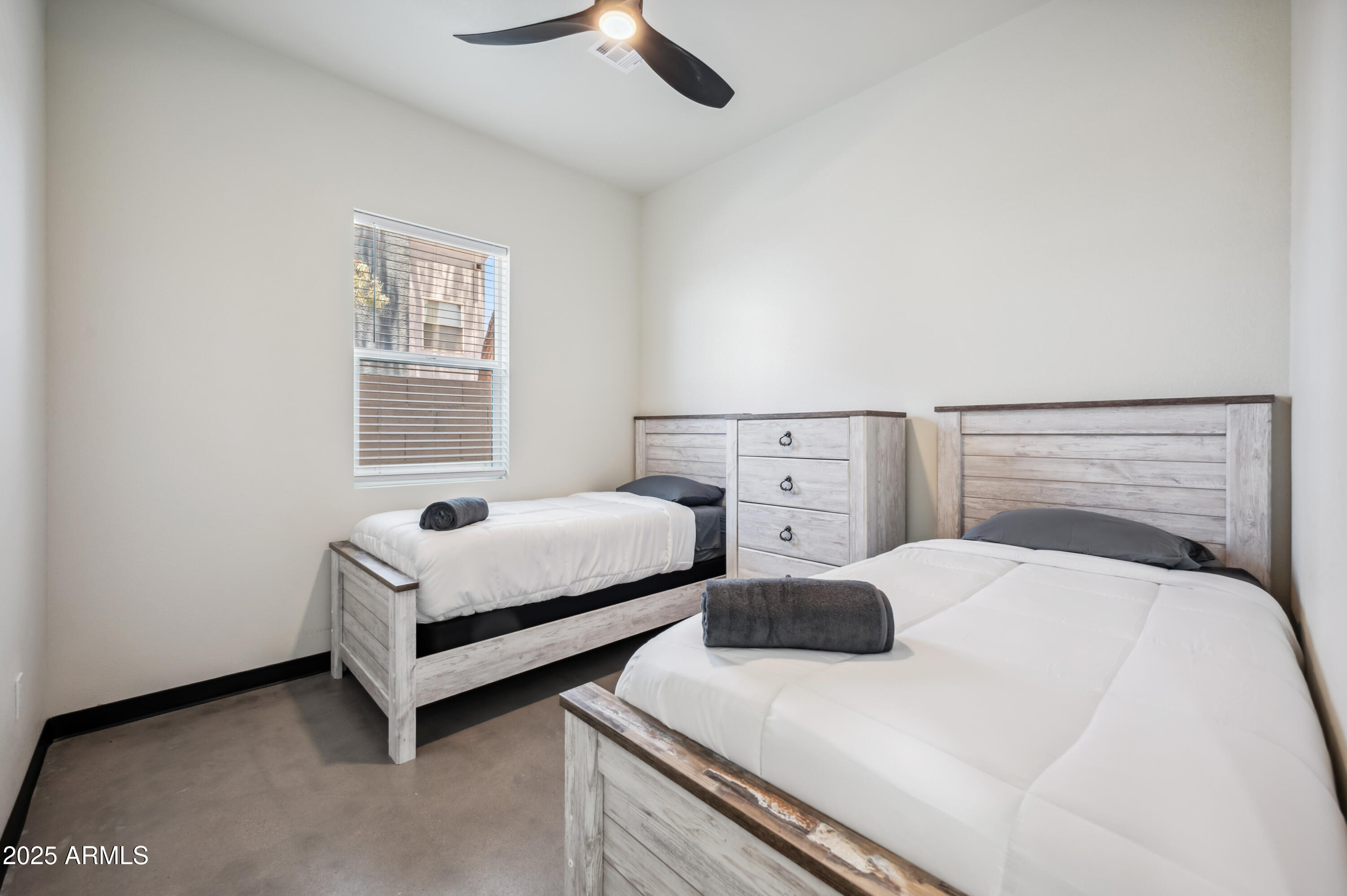 4136 North 11th Street Phoenix, AZ 85014 - Photo 17 of 33 a bedroom with a bed and a window