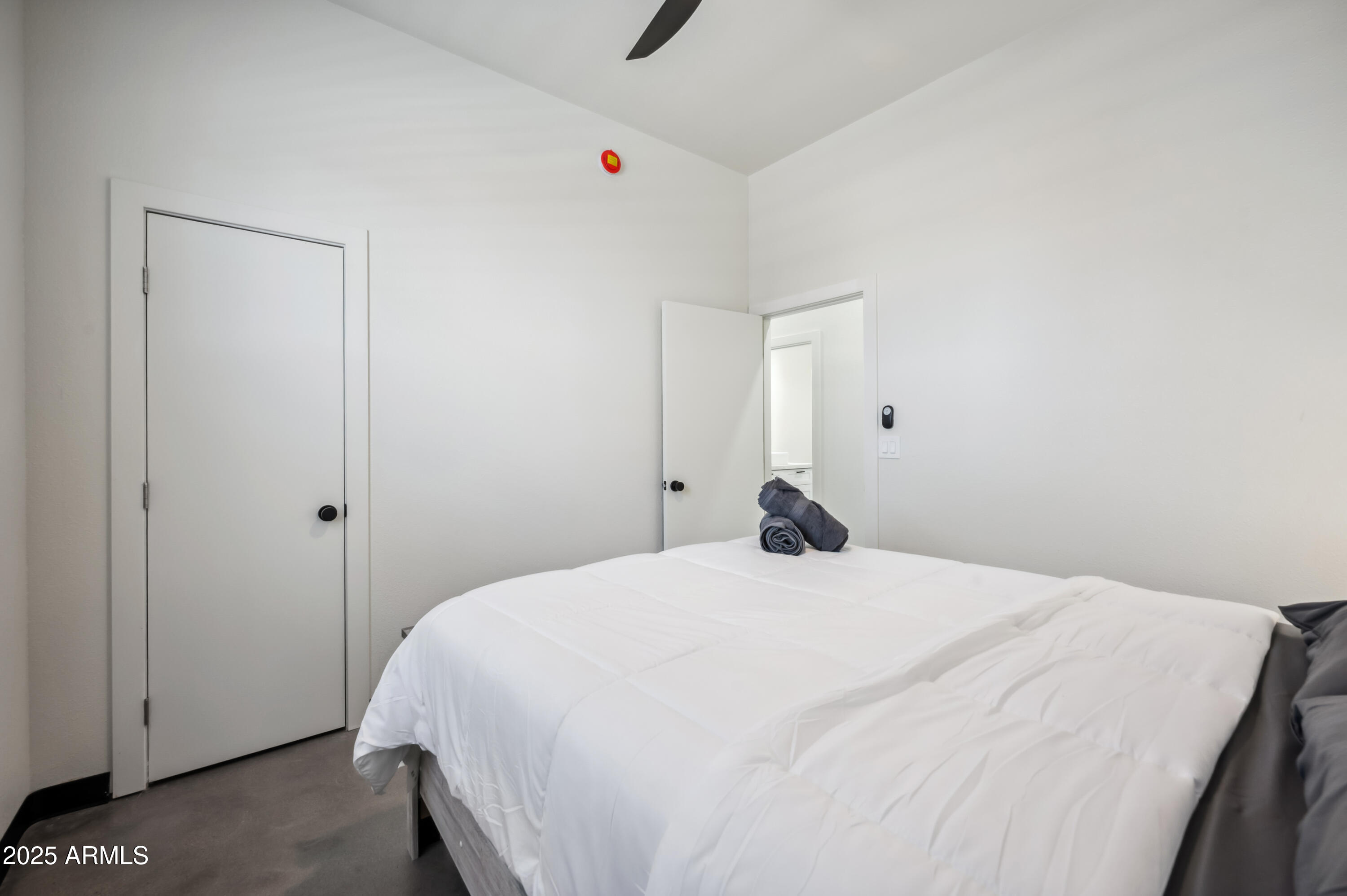 4136 North 11th Street Phoenix, AZ 85014 - Photo 32 of 33 a bedroom with a bed and cabinets