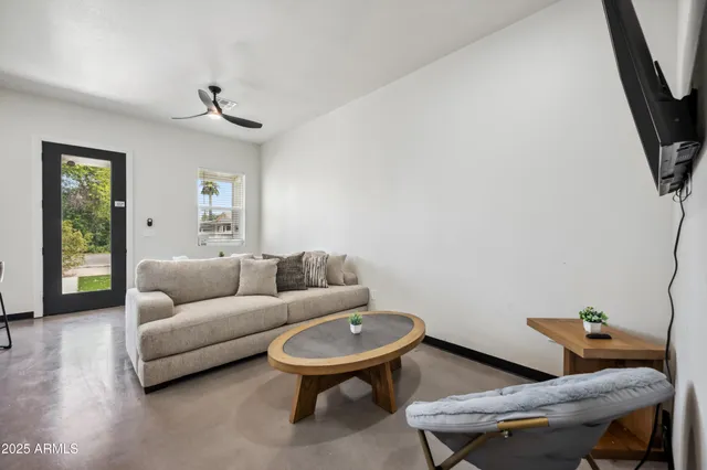 a living room with furniture and a window