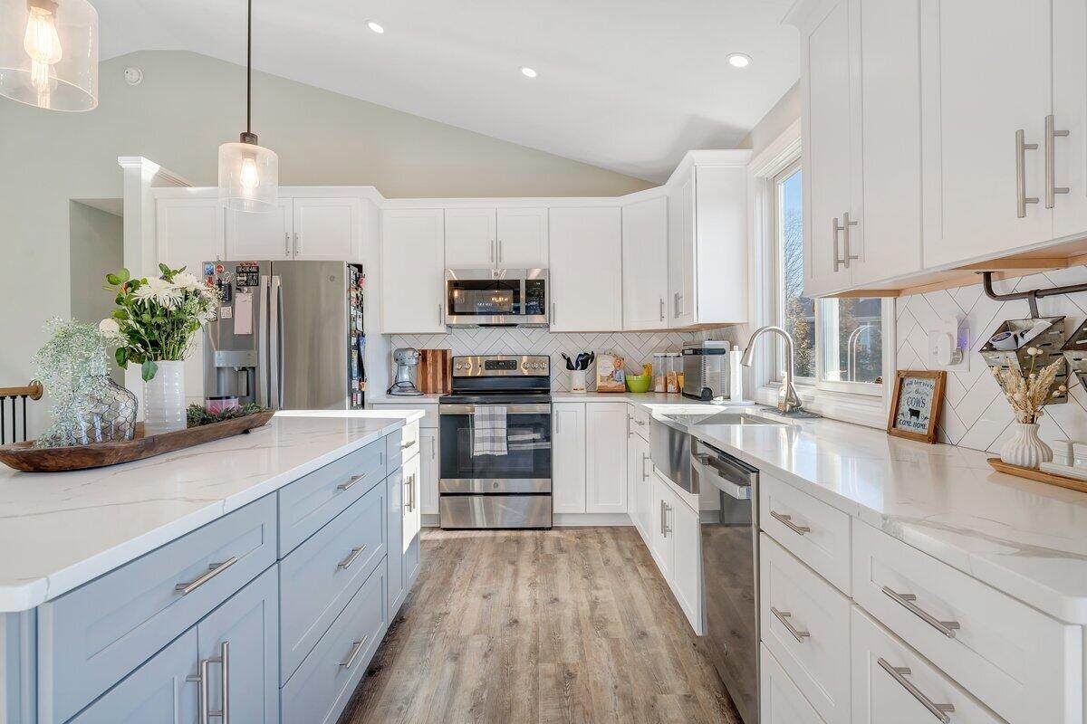 1685 Mountain View Road Vinton, VA 24179 - Photo 16 of 43 a kitchen with kitchen island white cabinets and white appliances