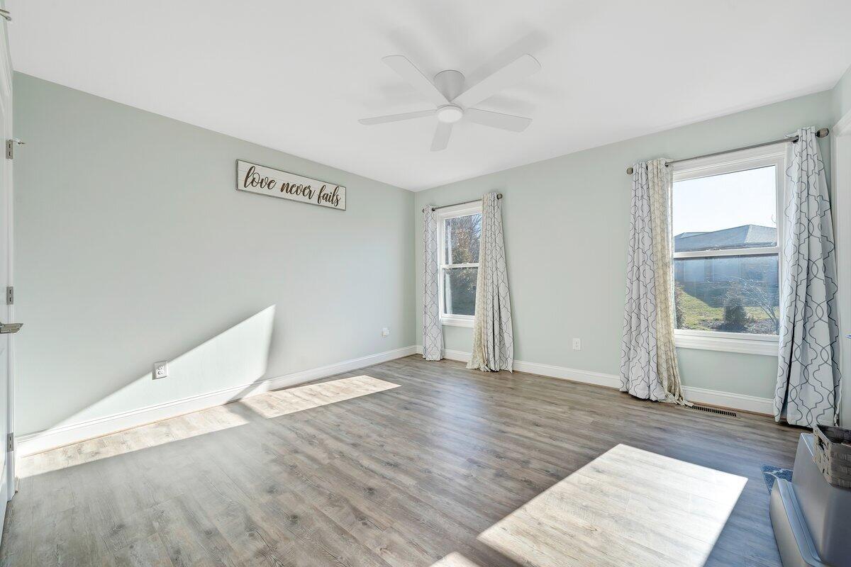 1685 Mountain View Road Vinton, VA 24179 - Photo 19 of 43 an empty room with wooden floor and windows