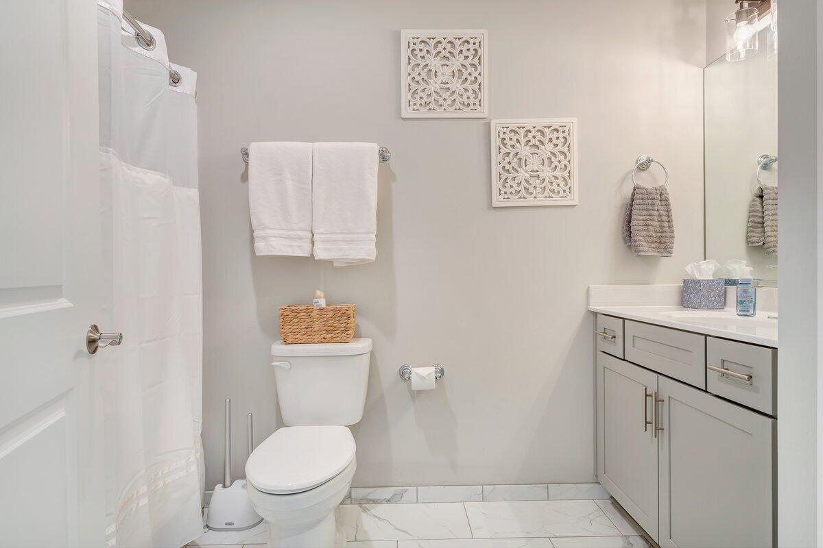 1685 Mountain View Road Vinton, VA 24179 - Photo 21 of 43 a bathroom with a toilet sink vanity and mirror