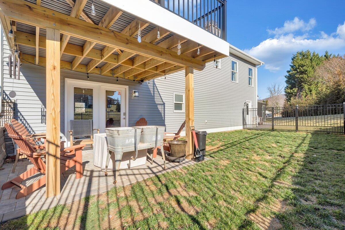 1685 Mountain View Road Vinton, VA 24179 - Photo 34 of 43 a view of a patio with table and chairs and wooden floor