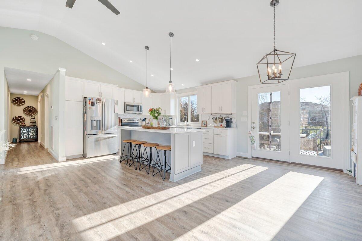 1685 Mountain View Road Vinton, VA 24179 - Photo 8 of 43 a open kitchen with stainless steel appliances granite countertop a refrigerator a oven a sink and white cabinets with wooden floor