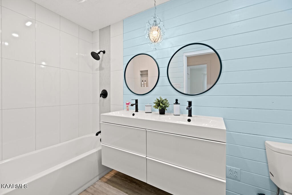403 Wells Spring Road Dandridge, TN 37725 - Photo 12 of 24 a bathroom with a toilet a sink and a mirror