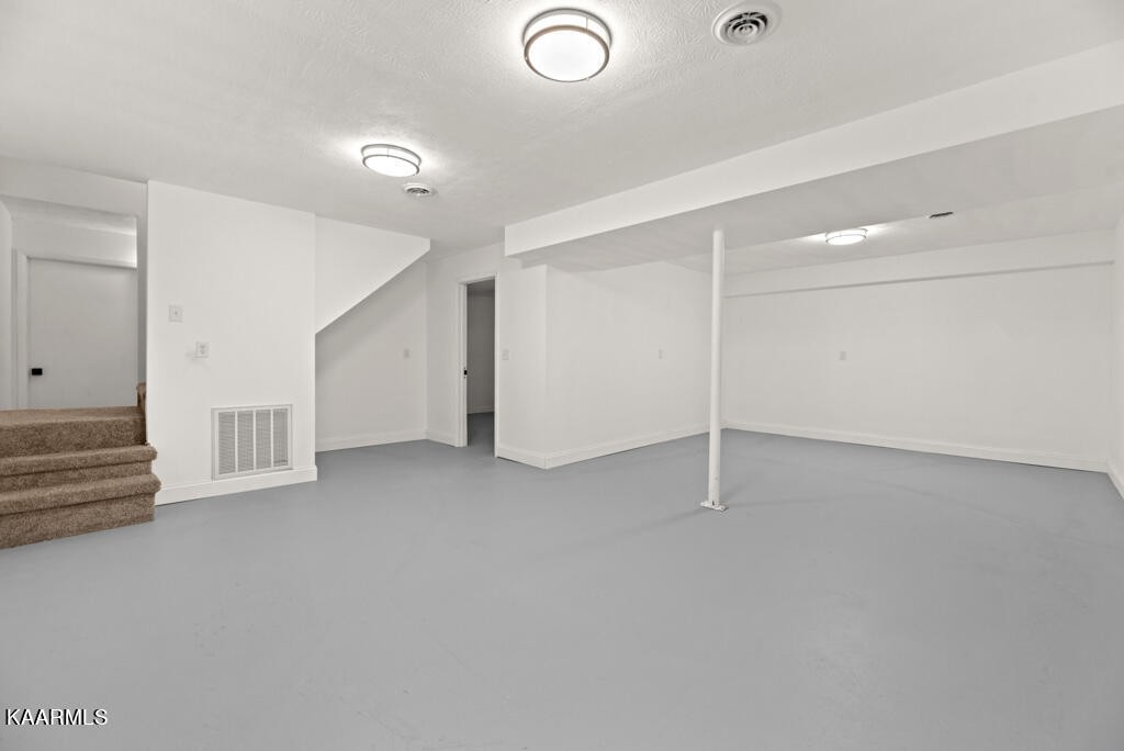 403 Wells Spring Road Dandridge, TN 37725 - Photo 17 of 24 an empty room with white walls and white walls