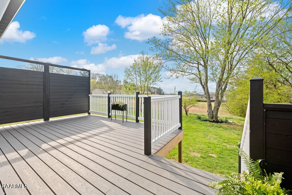 403 Wells Spring Road Dandridge, TN 37725 - Photo 18 of 24 a view of backyard with wooden fence and large trees