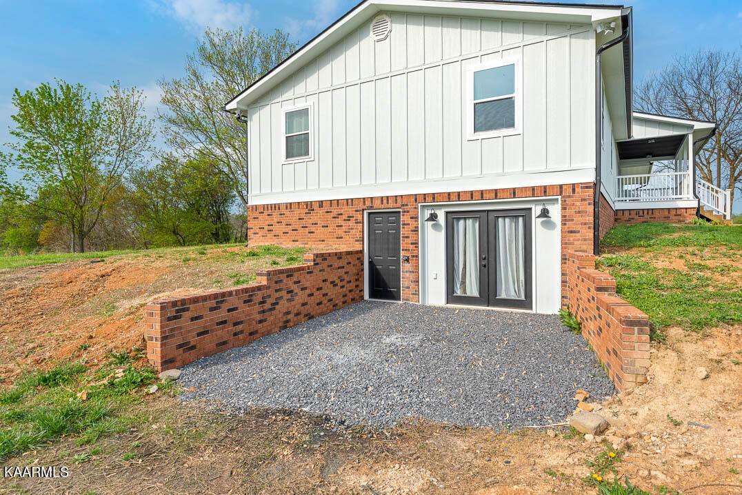 403 Wells Spring Road Dandridge, TN 37725 - Photo 20 of 24 a front view of a house with a yard