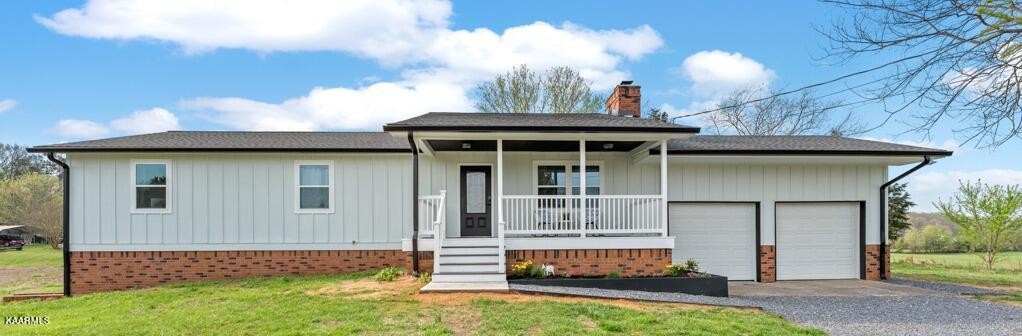 403 Wells Spring Road Dandridge, TN 37725 - Photo 3 of 24 a front view of a house with garden