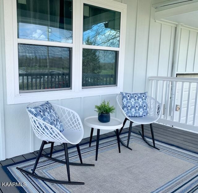 403 Wells Spring Road Dandridge, TN 37725 - Photo 4 of 24 a view of a chairs and table in a room
