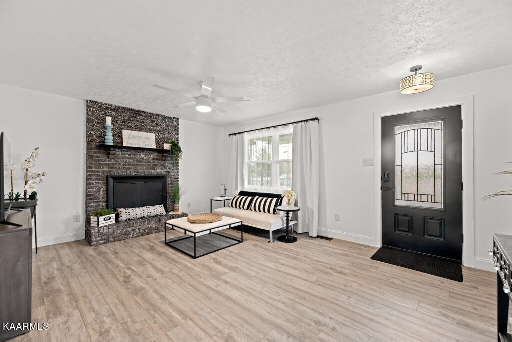 403 Wells Spring Road Dandridge, TN 37725 - Photo 6 of 24 a view of a livingroom with furniture and a fireplace