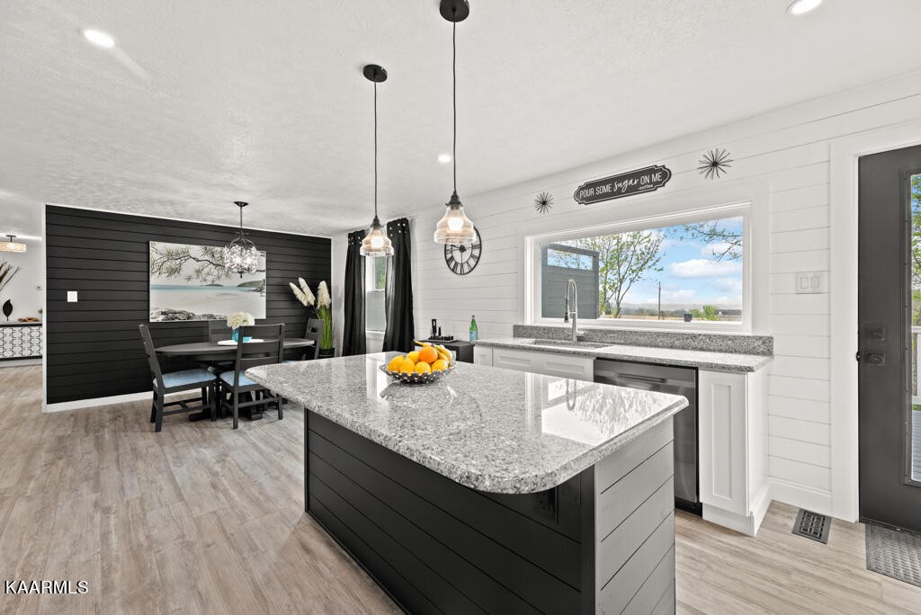 403 Wells Spring Road Dandridge, TN 37725 - Photo 10 of 24 a kitchen with a sink a counter space and a dining table