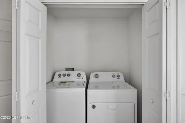 a view of a hallway with an empty room
