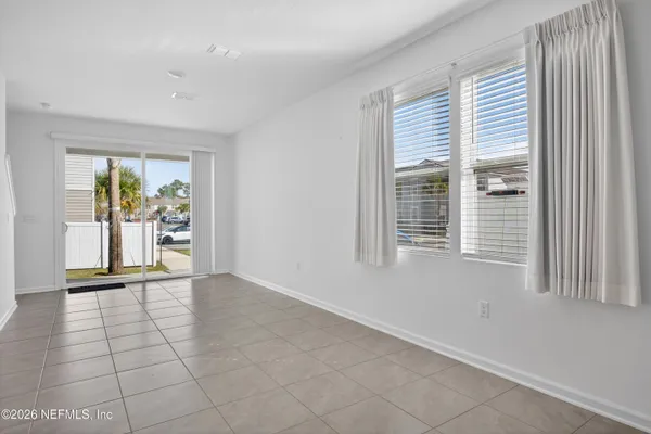 a bedroom with bed and a potted plant