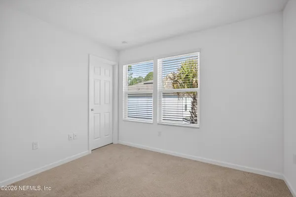 a bathroom with a shower sink vanity and mirror