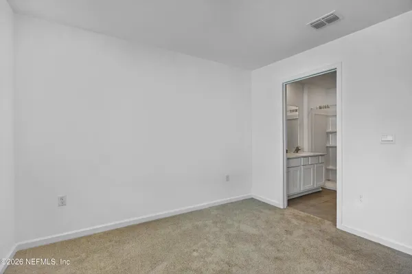 an empty room with closet area
