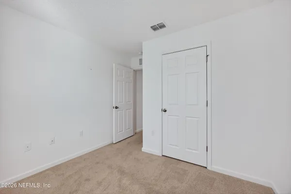 a bathroom with a shower and a curtain