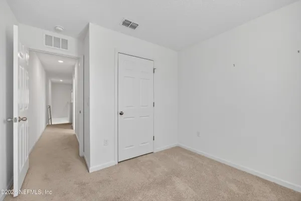 a kitchen with a table and chairs