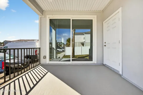 a view of a cars is parked in front of a house