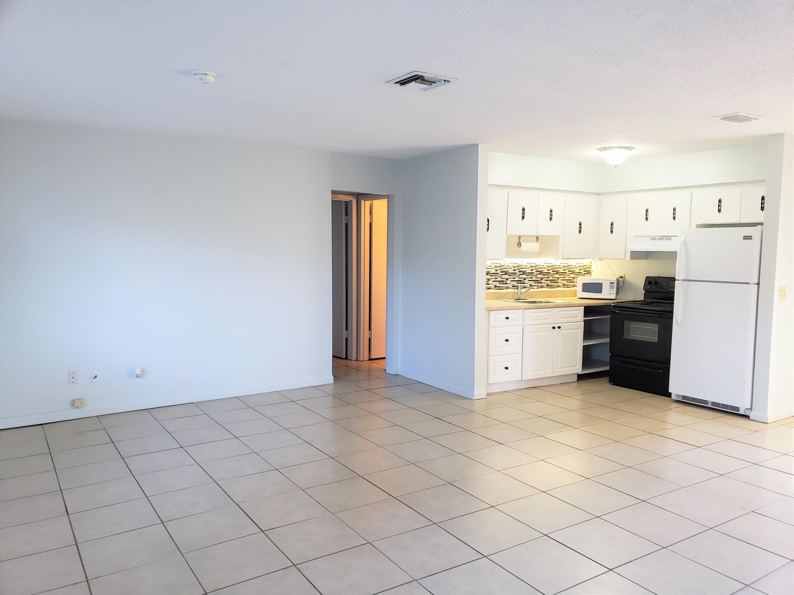 4752 Southeast Ebbtide Avenue, Unit 4752 Stuart, FL 34997 - Photo 2 of 8 a view of a kitchen with a sink