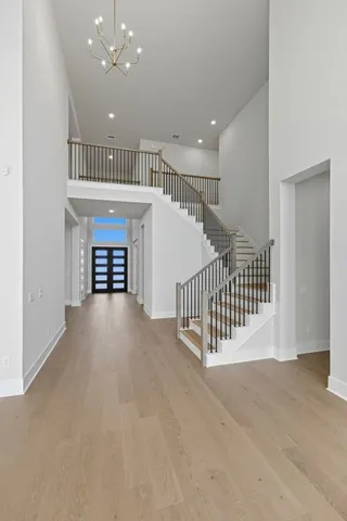 a view of a hallway with a staircase
