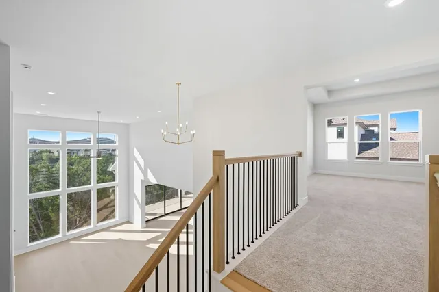 a view of a room with wooden floor and windows