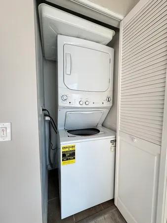 a kitchen with stainless steel appliances a stove a sink and a refrigerator
