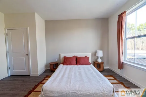 a bathroom with a sink toilet vanity and bathtub