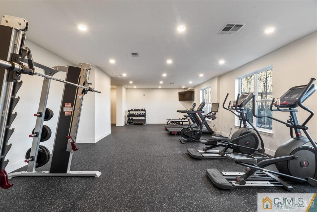 1 Nolan Way, Unit B32F North Brunswick, NJ 08902 - Photo 37 of 82 a view of a room with gym equipment