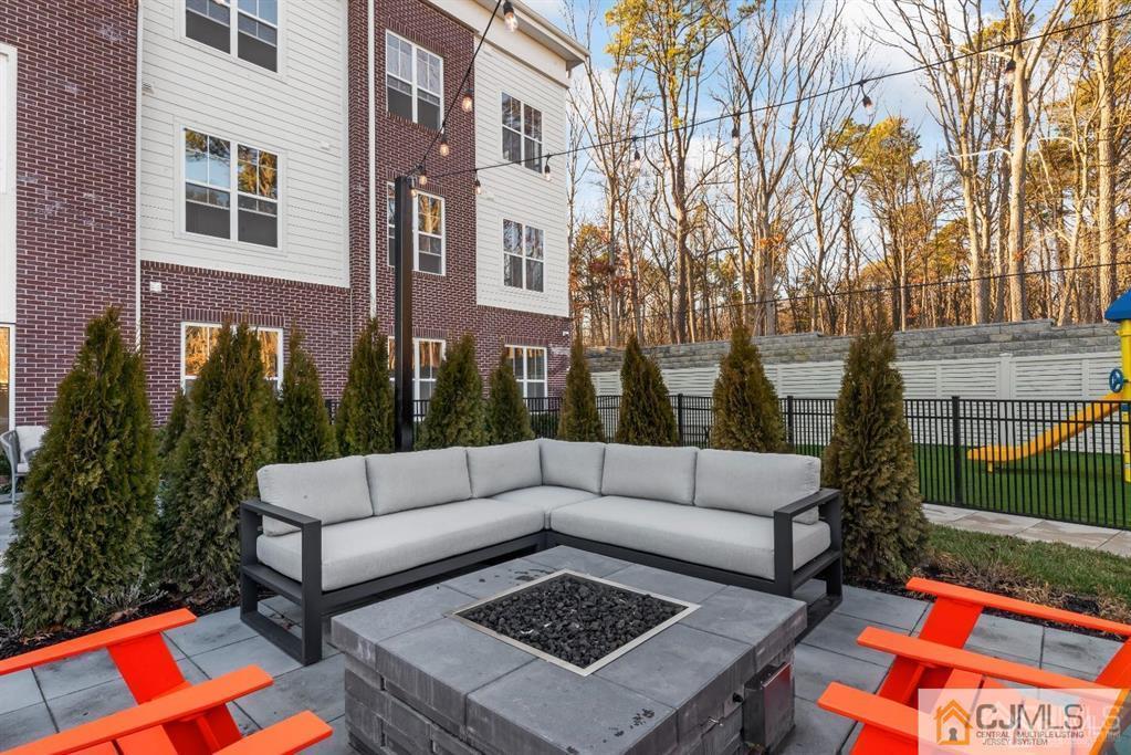 1 Nolan Way, Unit B32F North Brunswick, NJ 08902 - Photo 71 of 82 a view of a patio with couches and a table and chairs