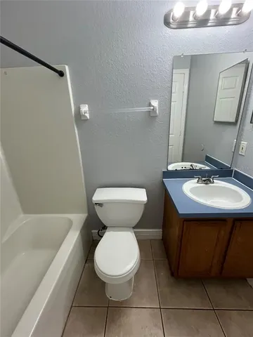 a bathroom with a sink toilet and bathtub