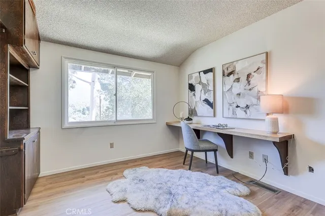 a workspace with furniture and window