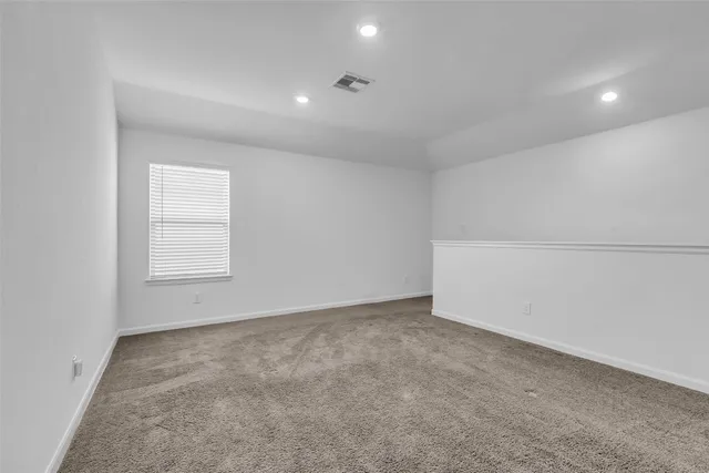an empty room with a empty space and window