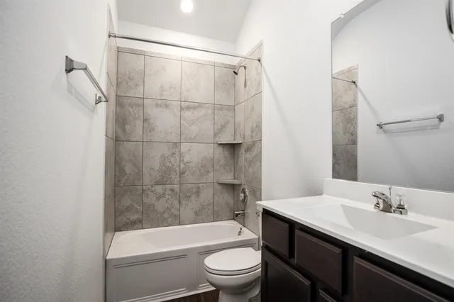 a bathroom with a sink a toilet and a bathtub
