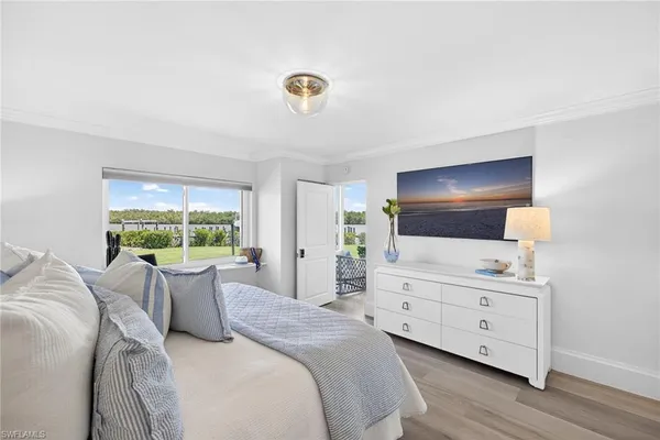 a room with a bed and a flat screen tv