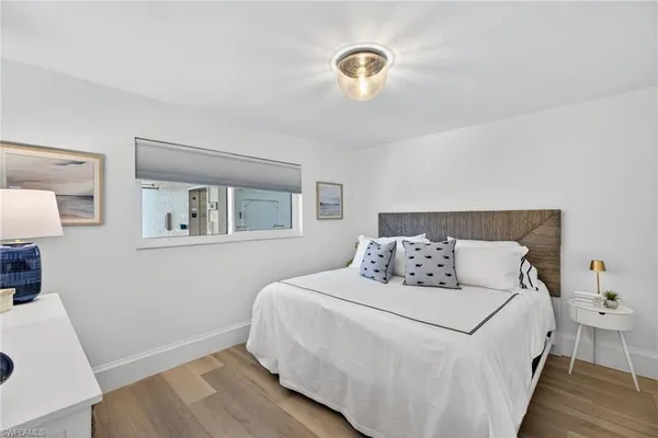 a bedroom with a bed and a table