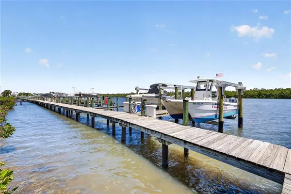 a view of a balcony with two chairs