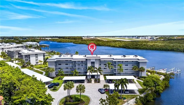 a view of swimming pool with outdoor seating and yard in back
