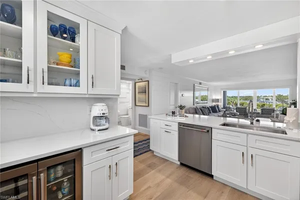 a kitchen with stainless steel appliances granite countertop a sink and cabinets