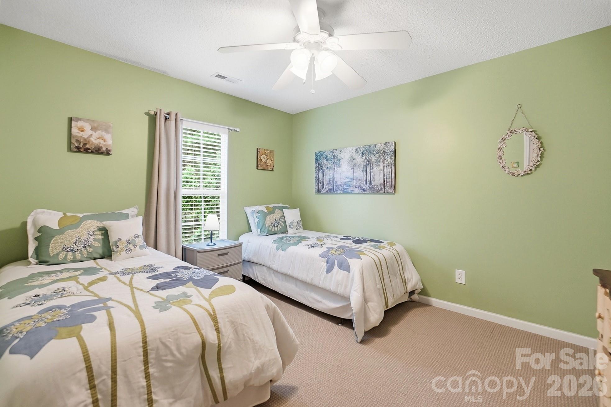 442 Sugar Maple Drive Tega Cay, SC 29708 - Photo 30 of 48 a bedroom with two beds and a window